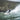 surfer in a wetsuit on a wave at north ceiriad in North Wales near Abersoch